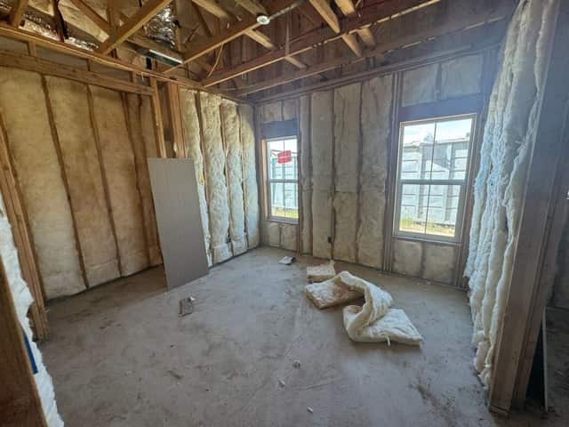 Framed and insulated bedroom with a new window, before drywall