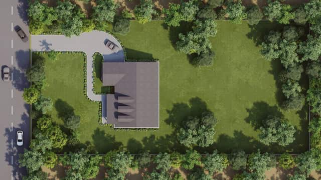 Overhead rendering of a model home plan sited on a large treed lot