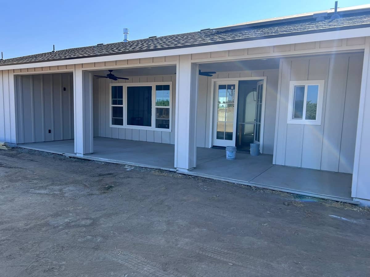 Front elevation of a finished single story home with a covered porch